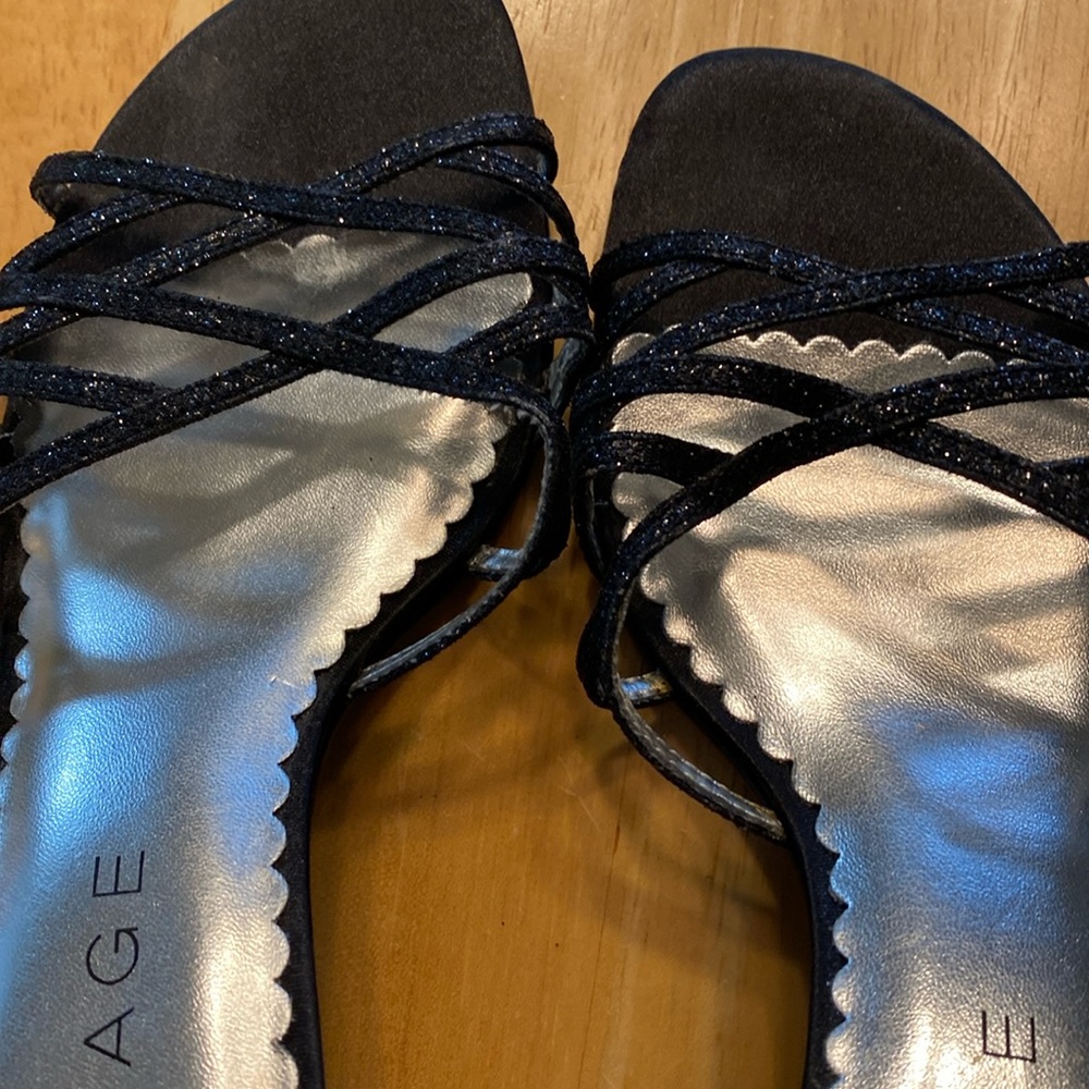 Like new approx. one and a half inch heel silver sparkles on the straps